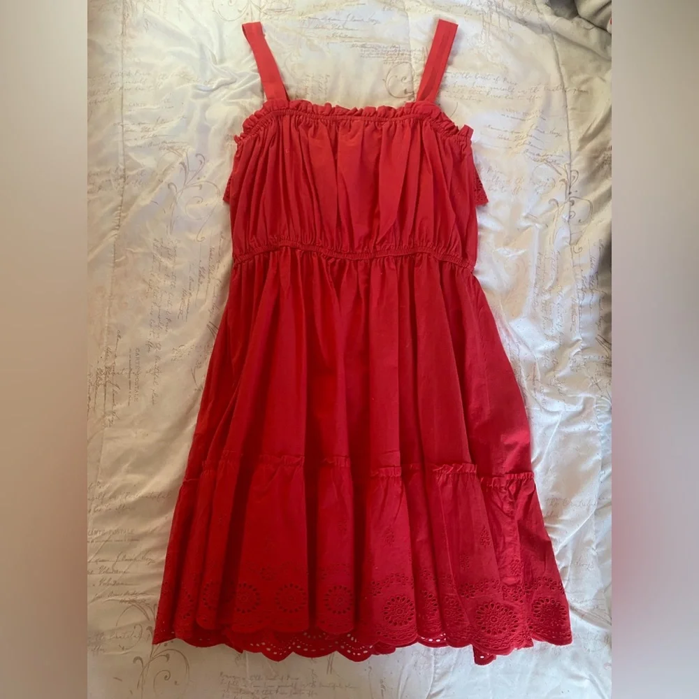 Red dress with designs on bottom and some at top - Picture 2 of 4